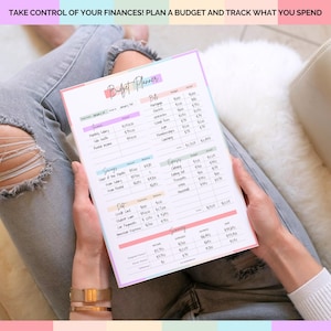 May include: A budget planner with pastel borders is held by a person. The planner includes sections for income, bills, savings, expenses, and debt. The text at the top reads: "TAKE CONTROL OF YOUR FINANCES! PLAN A BUDGET AND TRACK WHAT YOU SPEND."