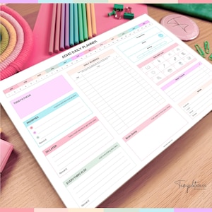 May include: ADHD daily planner with sections for daily schedule, priorities, and a brain dump. The planner has a white background with pastel pink, blue, and green accents. Includes space for rewards and a habit tracker.