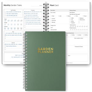 May include: A green spiral-bound Garden Planner notebook with gold lettering. The open notebook reveals pages for monthly garden tasks and plant information. The planner includes sections for sowing, harvesting, and plant care.