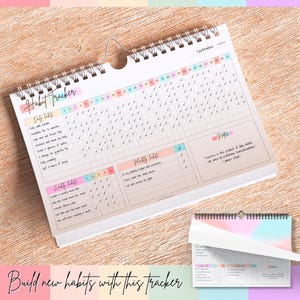 May include: A white spiral-bound habit tracker calendar, open to September, with a pastel color scheme. It features daily, weekly, and monthly habit tracking sections, with check boxes for each day. The text "Habit Tracker" is at the top.