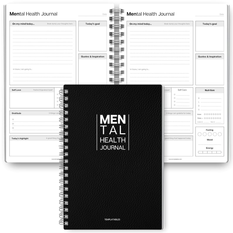May include: A black Mental Health Journal with the text "MENTAL HEALTH JOURNAL" in white. The journal is open, showing lined pages for daily reflections, goals, and inspiration. It is spiral-bound.