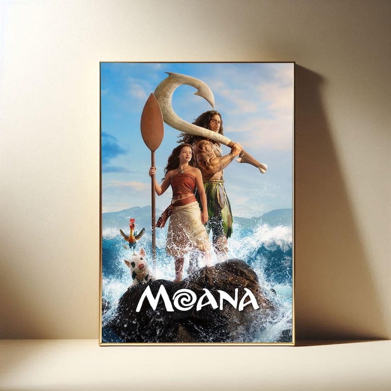 May include: Framed poster featuring characters from the animated film "Moana." The artwork depicts a young woman holding a paddle, a muscular man with a large hook, and a pig and rooster. The title "Moana" is displayed in white text on a rock.