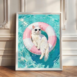 Peut inclure: Une impression d'art encadrée représente un chat blanc portant des lunettes de soleil, se prélassant dans un anneau gonflable à rayures roses et blanches dans une piscine turquoise. L'œuvre d'art a une ambiance estivale ensoleillée.
