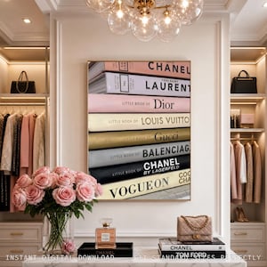 May include: A vertical wall art print featuring a stack of fashion books titled Chanel, Yves Saint Laurent, Dior, Louis Vuitton, Gucci, Balenciaga, and Vogue On. The books are arranged in a column with varied pastel and neutral colored spines.
