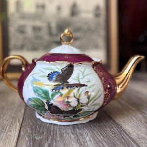 Tetera con forma de mariposa, oro de 24 quilates, color arándano, porcelana checa.