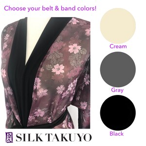 May include: A purple silk robe with a black trim and floral print. Choose from cream, gray, or black for the belt and band colors.  SILK TAKUYO.