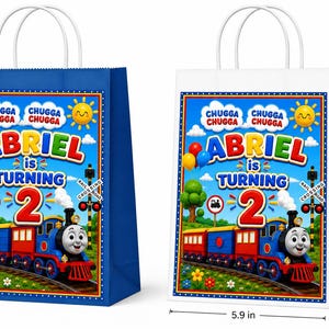 May include: Two paper gift bags, one blue and one white, featuring a train graphic with the text "ABRIEL is TURNING 2" and "CHUGGA CHUGGA". A dimension graphic indicates a height of 8.25 inches, a width of 5.9 inches, and a depth of 3.15 inches.