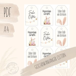 May include: A sheet of printable Easter gift tags. The tags are white with various designs, including bunny illustrations, Easter greetings, and bunny ears. The words "Frohe Ostern", "Hoppelige Grüße", and "Schöne Grüße vom Osterhasen" are printed on the tags.