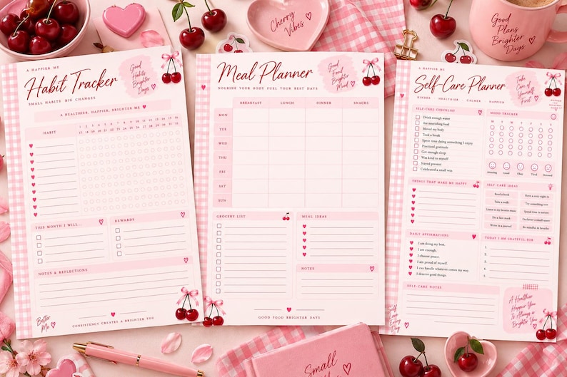 May include: Three pink and white gingham-themed paper planners titled Habit Tracker, Meal Planner, and Self-Care Planner. Each sheet features cherry illustrations, checkboxes, and lined sections for daily organization, goal setting, and personal notes.