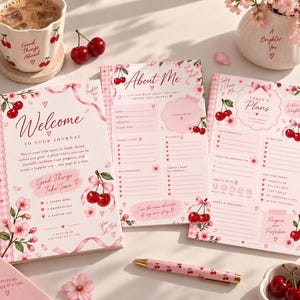May include: Three journals with a light pink theme featuring cherry and cherry blossom illustrations. The covers and pages display text including Welcome To Your Journal, About Me, and Today's Plans, accompanied by pink ribbons and hearts.
