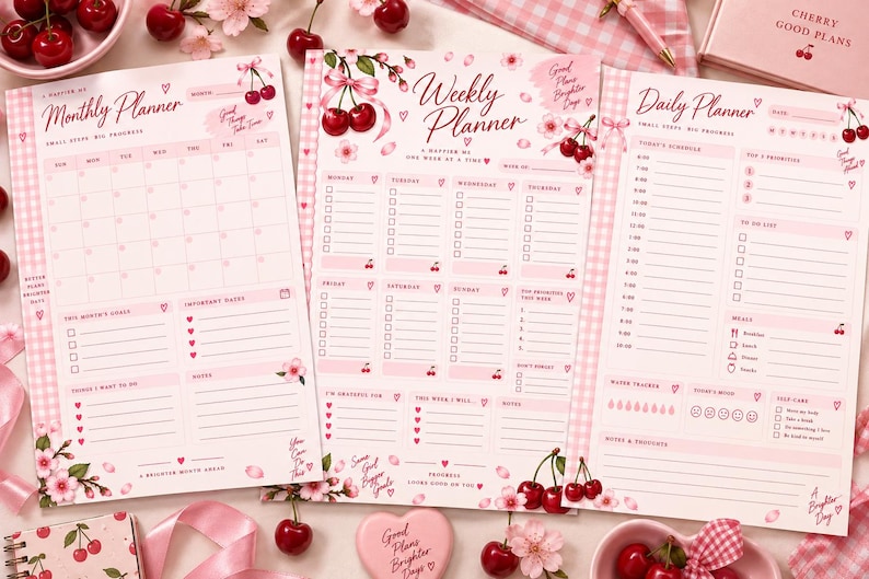 May include: Three pink planner sheets featuring a monthly, weekly, and daily layout. Each page is decorated with cherry and cherry blossom illustrations, pink gingham borders, and text including Monthly Planner, Weekly Planner, and Daily Planner.