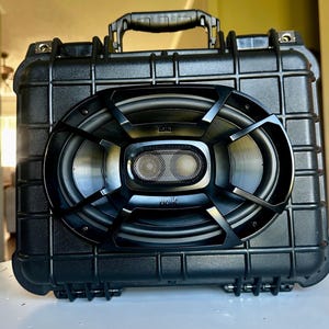 May include: A rustic wooden sign with the text "Welcome to our home" in white lettering. The sign has a distressed finish and a simple, inviting design, ideal for front door decor.