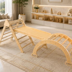 May include: A wooden climbing arch, slide, and climbing triangle set. The natural wood-toned play set is designed for toddlers and young children. The set is placed on a beige rug in a well-lit room.