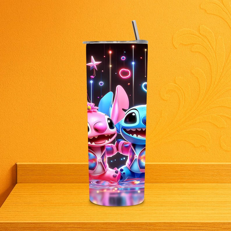 May include: A stainless steel tumbler with a cartoon illustration of two characters, one pink and one blue, set against a black backdrop with colourful lights. The tumbler has a silver straw and a black lid. A fun and colourful addition to any drinkware collection.