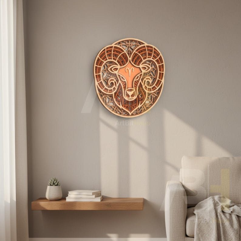 May include: A layered wooden wall art piece depicting the Aries zodiac sign. The artwork features a ram's head with intricate details and a warm color palette of browns and oranges. The piece is mounted on a neutral-colored wall.