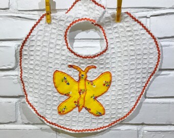 Cheery, Bright Butterfly! This butterfly appliqué is cut from fun, colorful, vintage fabric. White waffle weave cotton with ric rac edging