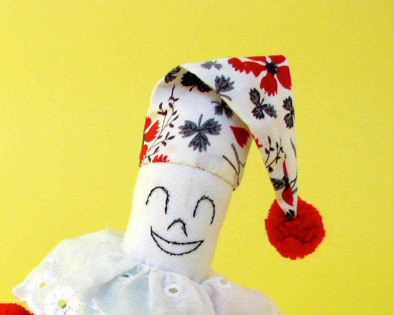 A fun playful bean bag clown doll made from vintage cottons. Etsy