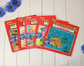 May include: A collection of five "The Magic School Bus" children's books with red covers. The titles include "The Magic School Bus Gets", "The Magic School Bus in the Haunted Museum", and "The Magic School Bus A Book About". Each book features colorful illustrations.