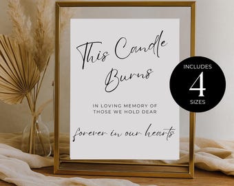 May include: A framed white sign with the text "This Candle Burns" in elegant script. The sign includes the phrases "In loving memory of those we hold dear" and "forever in our hearts." A black circle indicates that the sign is available in 4 sizes.