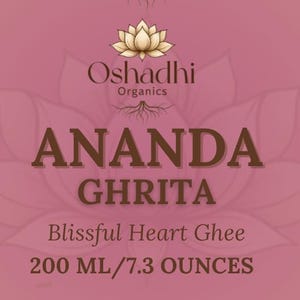 May include: A product label for Ananda Ghrita, a Blissful Heart Ghee, with text in brown and white on a pink background. The label includes supplement facts, ingredients, and the text "200 ml / 7.3 OUNCES". The product is from Oshadhi Organics.