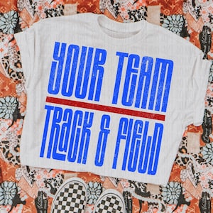 May include: White t-shirt with the text "YOUR TEAM TRACK & FIELD" in blue, with a red line separating the words. The shirt is paired with black and white checkered sneakers, set against a patterned background.