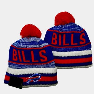May include: Two blue and red knit winter hats with the word "BILLS" in red block letters. The hats have a red pom-pom on top and a white stripe. The Buffalo Bills logo is on the front.