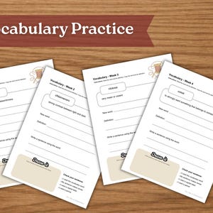 May include: Four white vocabulary practice worksheets with text and fill-in-the-blank sections are arranged on a wooden surface. The worksheets are labeled "Vocabulary - Week 1" through "Vocabulary - Week 4". The top banner reads "Vocabulary Practice".