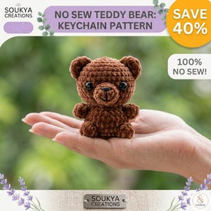 May include: A crocheted brown teddy bear keychain. The bear has black eyes and a small, stitched nose and mouth. The image includes text that reads "NO SEW TEDDY BEAR: KEYCHAIN PATTERN" and "SAVE 40%" and "100% NO SEW!"