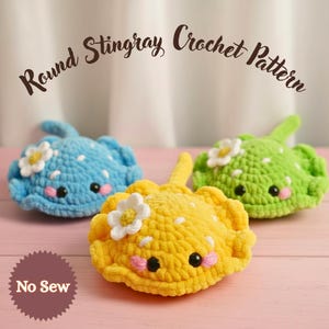 May include: Three crocheted stingrays in blue, yellow, and green, each with a white flower and pink cheeks. The text "Round Stingray Crochet Pattern" arches above them. The bottom left corner has a "No Sew" badge.