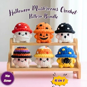 May include: Six small crocheted mushroom figures with Halloween themes, including a mummy, jack-o'-lantern, ghost, candy corn, and spider designs. The text reads Halloween Mushrooms Crochet Pattern Bundle, No Sew, and 6 in 1. The figures are displayed on a wooden shelf.