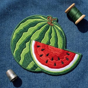 May include: An embroidered patch featuring a whole watermelon with dark and light green stripes and a brown stem, layered with a bright red watermelon slice showing black seeds and a white rind, accompanied by a green thread spool and a metal thimble.