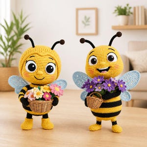 May include: Two handmade crochet bee figurines. The bees are yellow and black with blue wings, holding baskets of colorful flowers. The bees have smiling faces and are standing on a wooden surface.