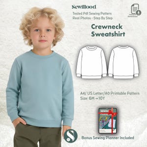 May include: A child wearing a light blue crewneck sweatshirt. The image includes a sewing pattern for a crewneck sweatshirt, with the text "Crewneck Sweatshirt", "Tested Pdf Sewing Pattern", and "Bonus Sewing Planner Included".