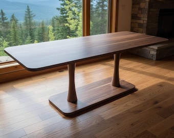 無垢のウォールナット製ダイニングテーブル、モダンな台座付き、手作りのミニマルなキッチン家具