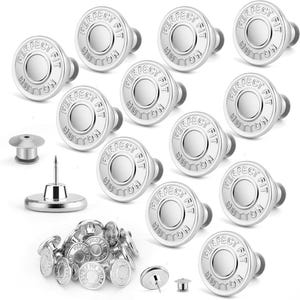 May include: A collection of silver-colored metal buttons with the text "PERFECT FIT BUTTON" embossed on the face. The image shows various button styles, including those with a pin and backing for attachment. The buttons are designed for clothing.