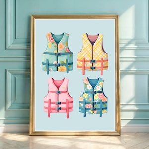 May include: A framed art print featuring four life vests arranged in a grid. The top left vest is light blue with floral patterns, the top right is yellow plaid, the bottom left is solid pink, and the bottom right is blue with white and pink flowers.