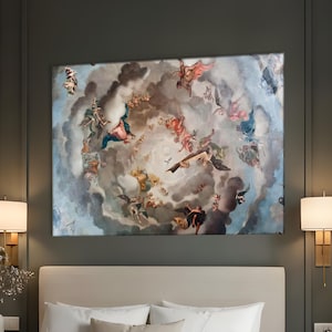 May include: A large rectangular canvas art piece depicting a Renaissance-style fresco of figures in a cloudy sky, mounted above a bed. The artwork features a palette of blues, reds, and golds. The bedroom has a neutral color scheme with matching lamps.