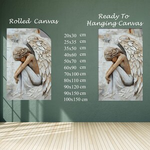 May include: Rolled and ready-to-hang canvas prints featuring a serene angel figure with large wings. The artwork depicts the angel in a seated pose, rendered in neutral tones. Available sizes range from 20x30 cm to 100x150 cm.