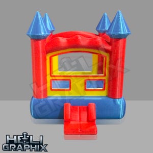 May include: A miniature red, yellow, and blue inflatable castle with four blue turrets. The castle has a red entrance and a yellow window. The base is blue. The text "HELI GRAPHIX" is at the bottom.