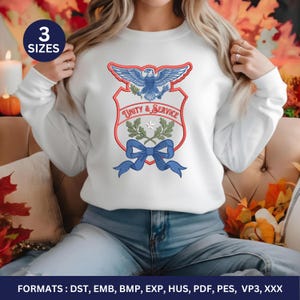 May include: White sweatshirt with a shield design featuring an eagle, olive branches, and a blue bow. The text "UNITY & SERVICE" is embroidered in red. The image also includes the text "3 SIZES" and "FORMATS: DST, EMB, BMP, EXP, HUS, PDF, PES, VP3, XXX".