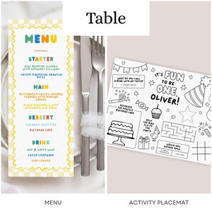 May include: A printed menu with a yellow checkered border and colorful text listing food and drink options, alongside a black and white activity placemat featuring birthday-themed illustrations, games, and the text It's Fun To Be One, Oliver.