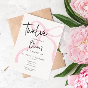 May include: A birthday invitation featuring the word "Twelve" in cursive. The invitation is for Olivia's 12th birthday, with the date, time, and location details. A pink bow design decorates the invitation, set against a white background.