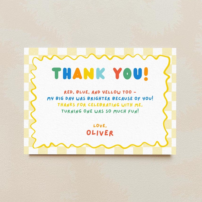 May include: A rectangular thank you card featuring a yellow and white checkered border with a wavy yellow frame. The text reads: THANK YOU! RED, BLUE, AND YELLOW TOO - MY BIG DAY WAS BRIGHTER BECAUSE OF YOU! THANKS FOR CELEBRATING WITH ME, TURNING ONE WAS SO MUCH FUN! LOVE, OLIVER.