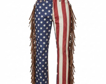 May include: Jeans with an American flag design. The left leg features a blue background with white stars, while the right leg has red and white stripes. Brown fringe accents the sides, and a brown leather waistband completes the look.