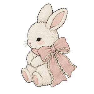 Peut inclure: Un lapin blanc brodé avec des détails roses. Le lapin porte un grand nœud rose avec une bordure festonnée. Il est assis, les bras croisés et les oreilles dressées. Le lapin a des yeux noirs et des joues roses.