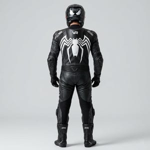 Back view of men's black one-piece leather motorcycle racing suit with large white spider graphic VR branding spiderweb embossed panels and CE armor protection worn with matching helmet