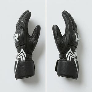 Side view of black leather Venom Racing motorcycle gloves showing carbon knuckle armor finger protection adjustable wrist strap and spider web graphic detail