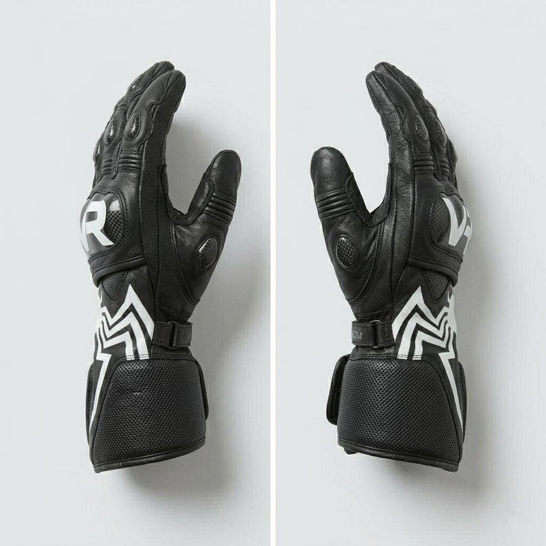 Side view of black leather Venom Racing motorcycle gloves showing carbon knuckle armor finger protection adjustable wrist strap and spider web graphic detail