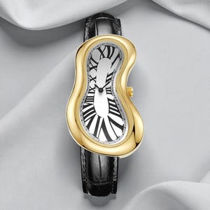 May include: A gold-toned wristwatch with a melting, distorted face and black Roman numerals. The watch has a black leather band. The watch face is white with black Roman numerals and hands. The watch has a unique, surreal design.