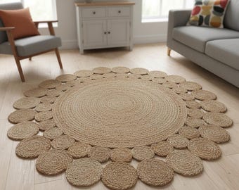 May include: A round, tan-coloured rug crafted from braided natural fibre. The rug features a large, solid circular centre surrounded by a decorative border of smaller, individual circular braided segments that create a scalloped edge effect.
